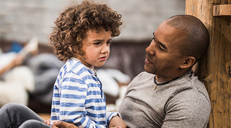 Father helping children navigate their emotions
